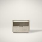 A contemporary nightstand featuring a light wood frame, open shelf, and single drawer with minimalist cut-out handle.