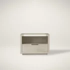 A contemporary nightstand featuring a light wood frame, open shelf, and single drawer with minimalist cut-out handle.