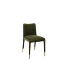 Conifer Dining Chair in rich green velvet with brass leg caps.