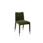 Conifer Dining Chair in rich green velvet with brass leg caps.