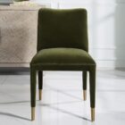 Conifer Dining Chair in rich green velvet with brass leg caps.