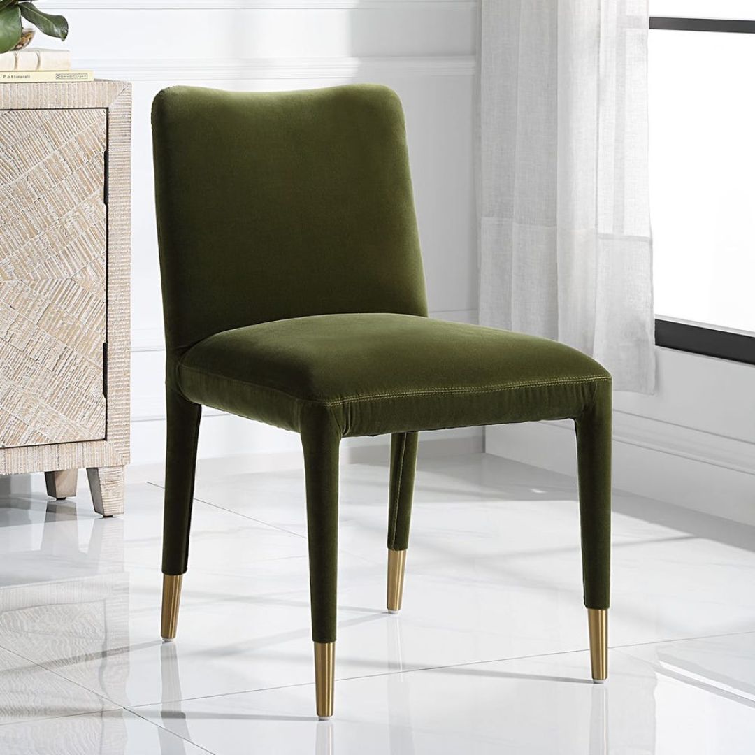 Conifer Dining Chair in rich green velvet with brass leg caps.