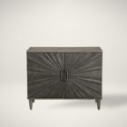 Dark wood two-door cabinet with sunburst carved front panel and modern rectangular handles.