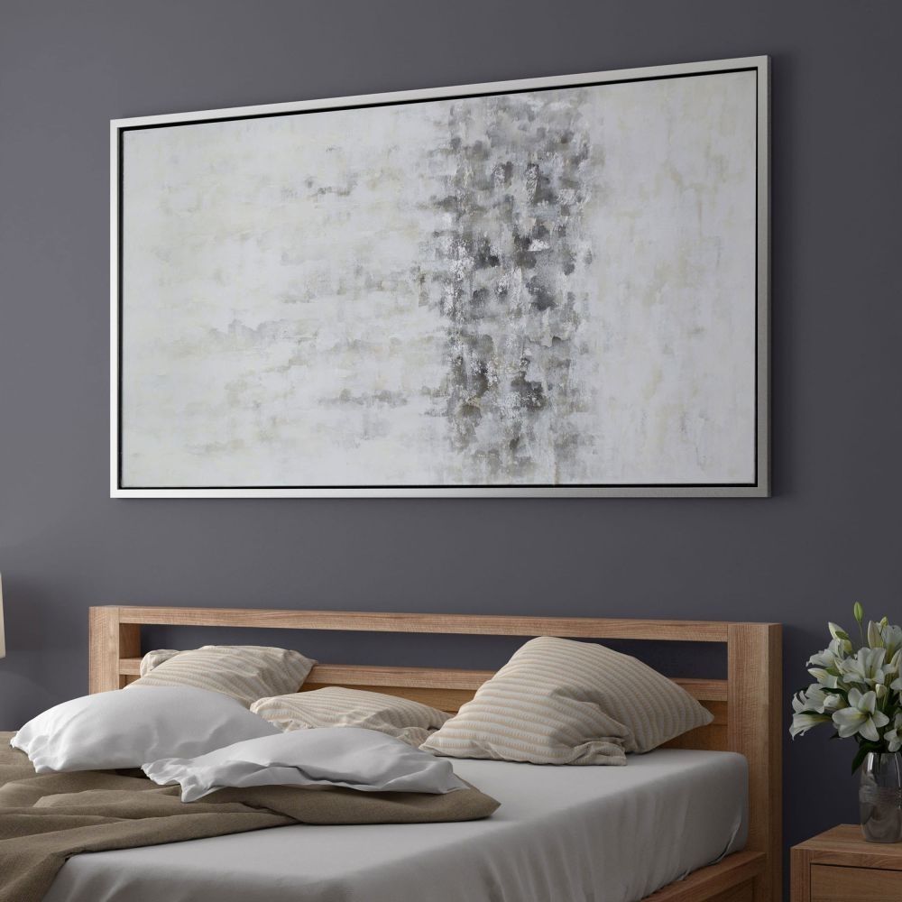 Abstract wall art featuring a softly blended palette of whites, greys, and subtle metallics, framed in a slim black frame.