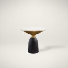 Sculptural end table featuring a white round marble top, flared gold accent, and fluted black wood base.
