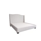Elegant beige upholstered Layla Bed with curved headboard and minimalist bedroom styling.