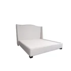 Elegant beige upholstered Layla Bed with curved headboard and minimalist bedroom styling.