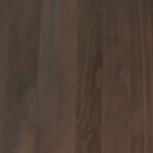 60-inch round pedestal dining table in dark-stained solid wood with a sculptural, turned base and smooth beveled edge.