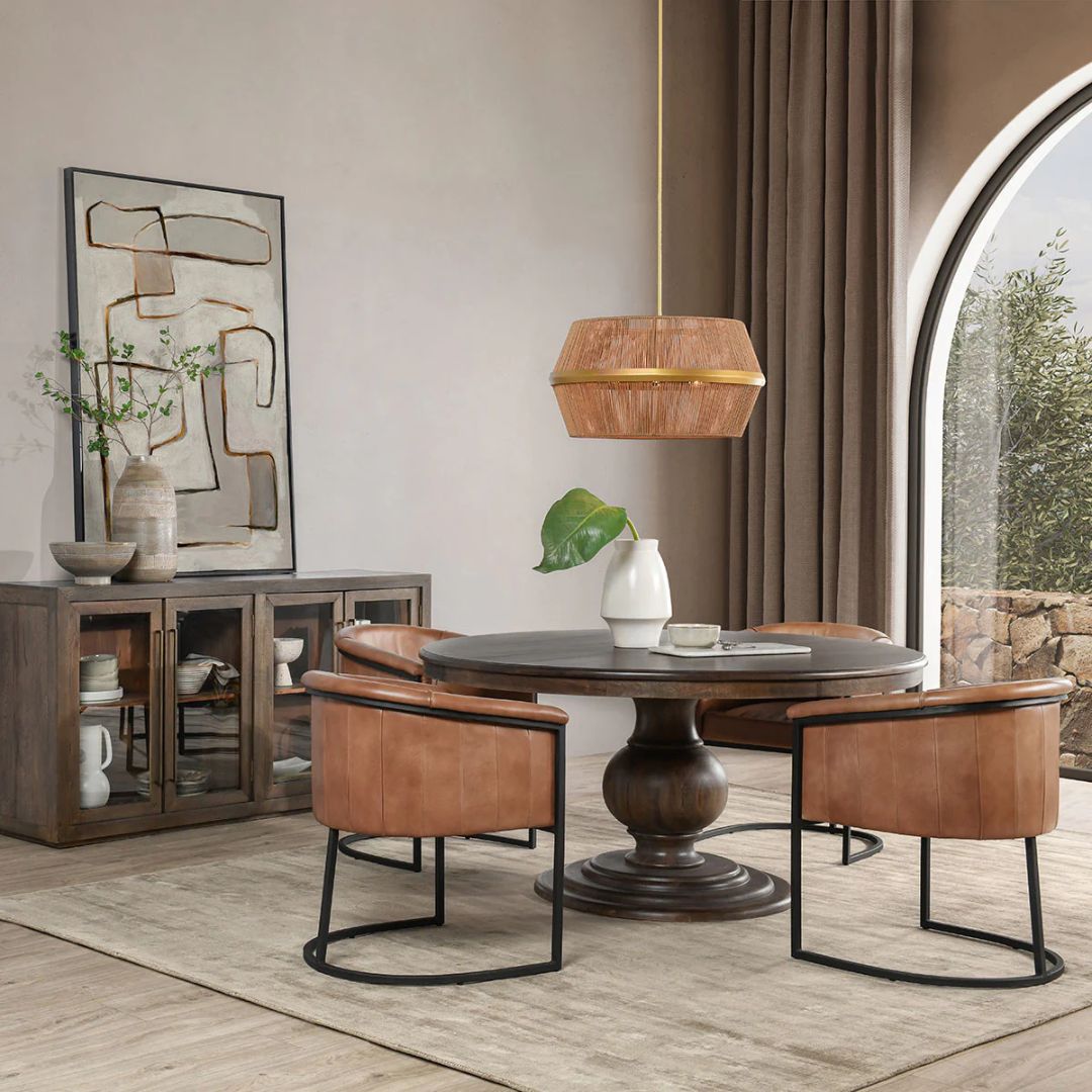 60-inch round pedestal dining table in dark-stained solid wood with a sculptural, turned base and smooth beveled edge.
