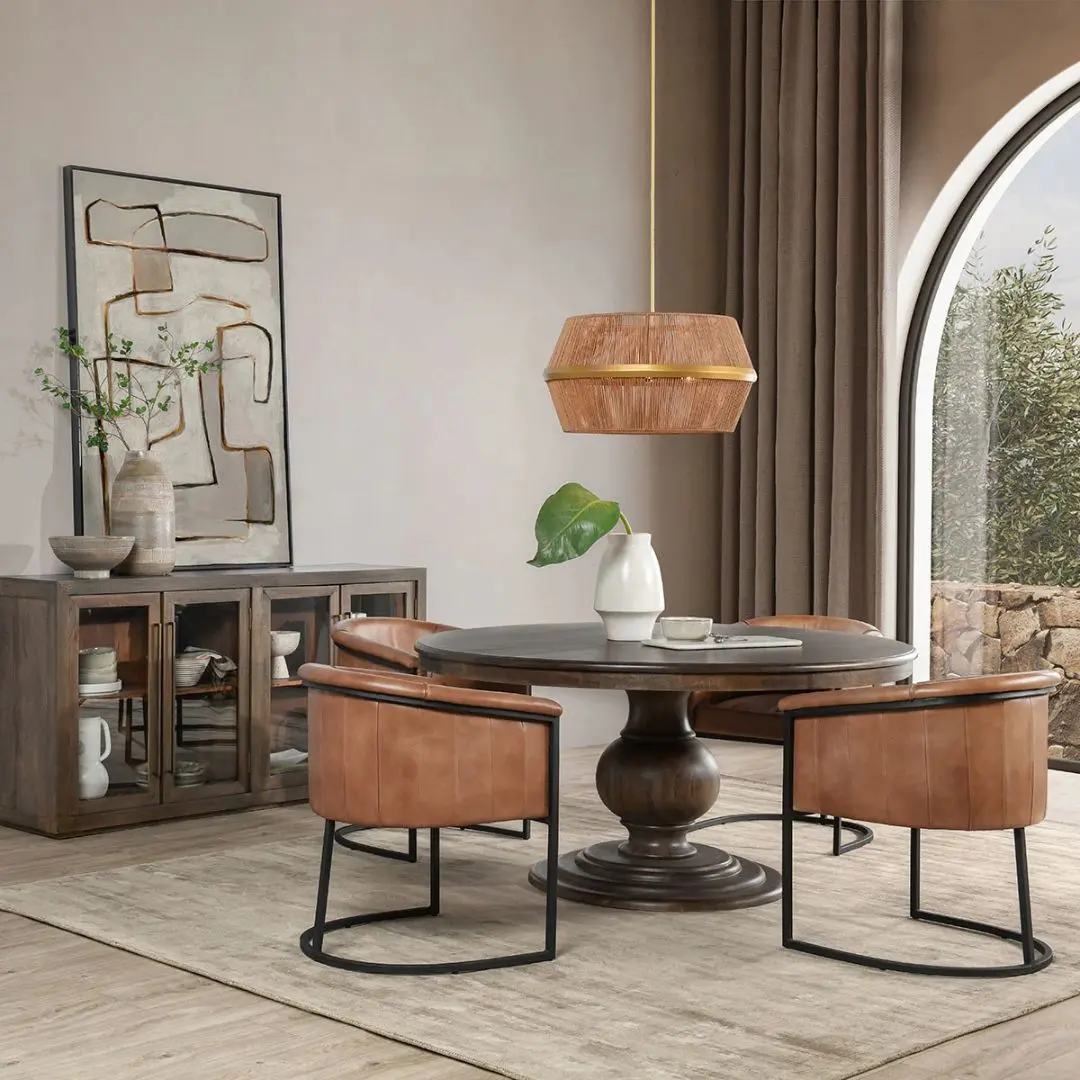 60-inch round pedestal dining table in dark-stained solid wood with a sculptural, turned base and smooth beveled edge.