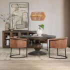 60-inch round pedestal dining table in dark-stained solid wood with a sculptural, turned base and smooth beveled edge.