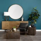 Round wall mirror with slim metal frame.