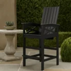 A black outdoor pub-height chair with slatted back, contoured seat, and armrests, designed with a durable frame and footrest.