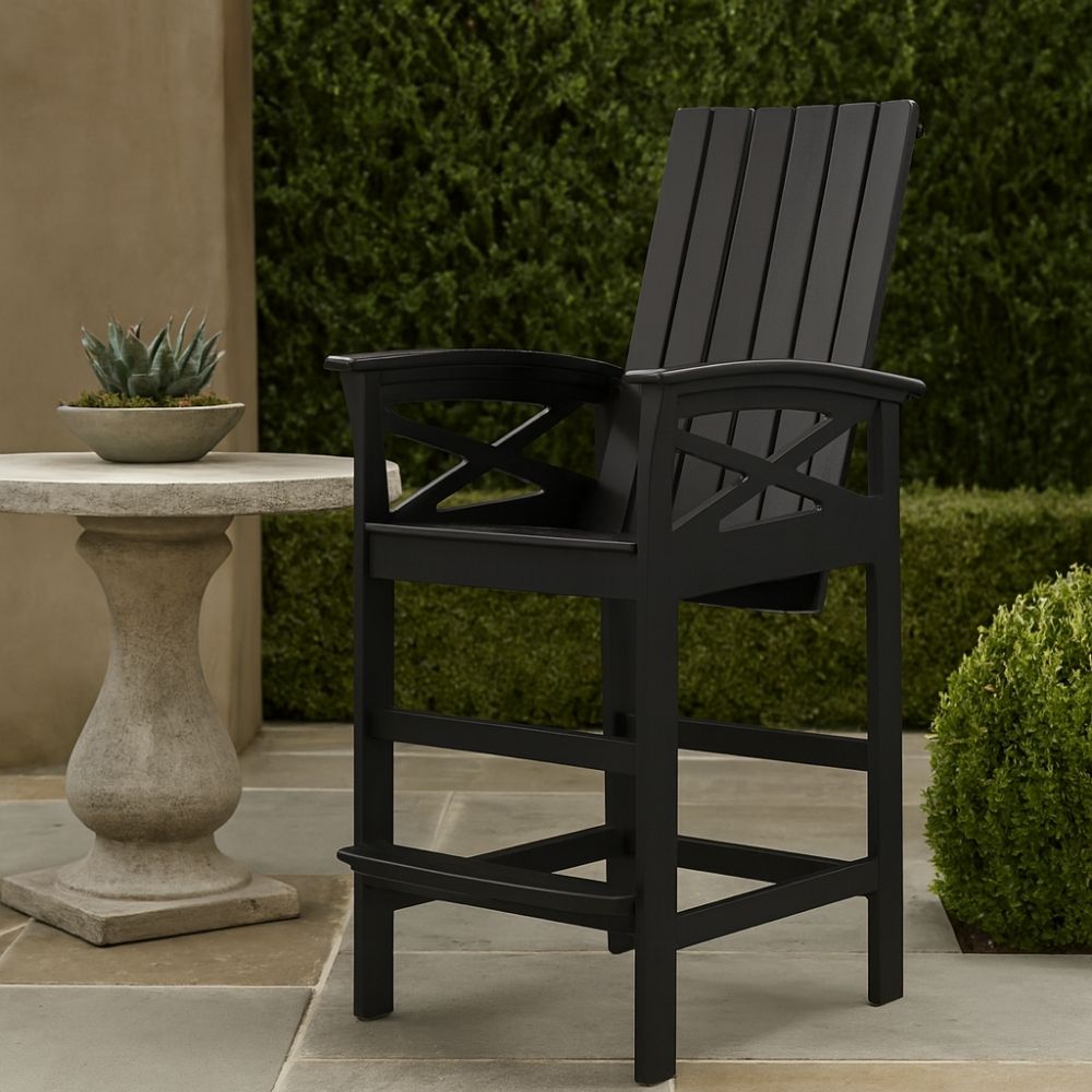 A black outdoor pub-height chair with slatted back, contoured seat, and armrests, designed with a durable frame and footrest.
