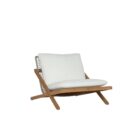 Outdoor lounge chair with angled wood frame and plush white cushions.
