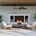 Outdoor lounge chair with angled wood frame and plush white cushions.