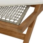 Outdoor teak stool with white cushion and slatted wood frame.