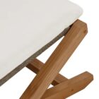 Outdoor teak stool with white cushion and slatted wood frame.