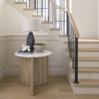 Mercana Enzo end table with a white marble top and fluted wood base in a natural finish.