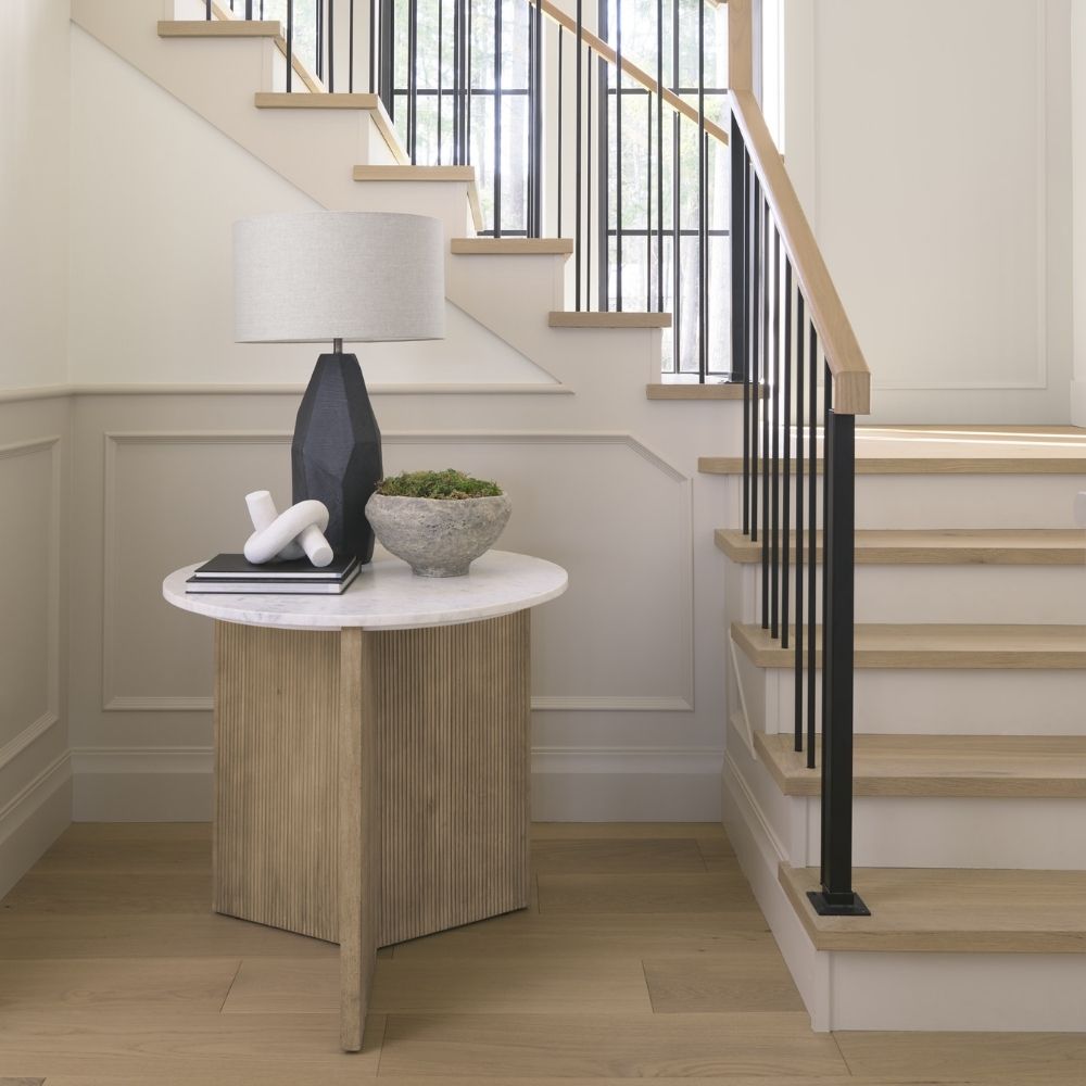 Mercana Enzo end table with a white marble top and fluted wood base in a natural finish.