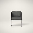 Modern outdoor dining chair with charcoal cushions, black woven frame, and sleek stainless steel base.