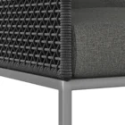 Modern outdoor dining chair with charcoal cushions, black woven frame, and sleek stainless steel base.