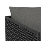 Modern outdoor dining chair with charcoal cushions, black woven frame, and sleek stainless steel base.