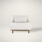 Contemporary outdoor armless lounge chair with white cushions, natural wood base, and black metal legs.