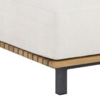 Contemporary outdoor armless lounge chair with white cushions, natural wood base, and black metal legs.