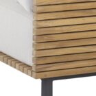 Contemporary outdoor armless lounge chair with white cushions, natural wood base, and black metal legs.