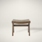 Low wood accent stool with woven cane seat and sculpted legs in a weathered oak finish.