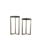 Pair of round nesting accent tables with charcoal wood tops and antique brass metal frames.