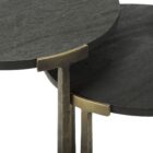 Pair of round nesting accent tables with charcoal wood tops and antique brass metal frames.