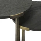 Pair of round nesting accent tables with charcoal wood tops and antique brass metal frames.