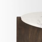 Round marble-top coffee table with cross-shaped dark wood base.