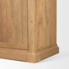 Tall bookcase with brass-toned metal frame, natural wood shelves, and a closed wood cabinet at the base.