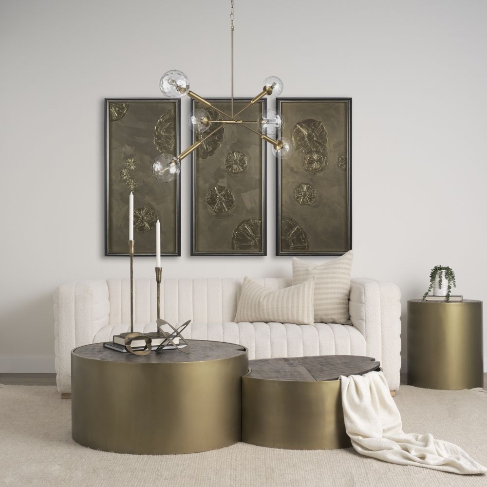Modern chandelier with six hammered glass globe bulbs and a brushed brass angular frame.