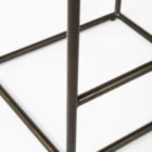 Minimalist counter-height stool with dark woven leather seat and slender black metal frame.