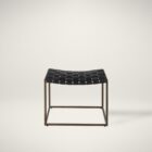 Modern ottoman with black woven leather seat and brass-finished metal frame.
