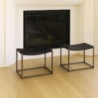 Modern ottoman with black woven leather seat and brass-finished metal frame.