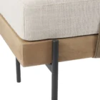 Mercana Colburne bench with beige cushion, natural wood base, and black metal legs, featuring a strapped bolster pillow.