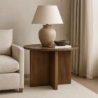 Round wooden accent table with ribbed fluted base and rich walnut finish.