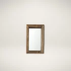 Rustic vertical wall mirror with thick reclaimed wood frame and natural imperfections.