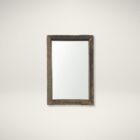 Rustic vertical wall mirror with thick reclaimed wood frame and natural imperfections.