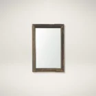 Rustic vertical wall mirror with thick reclaimed wood frame and natural imperfections.