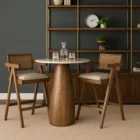 Mid-century style wooden bar stool with cane backrest, beige fabric seat, and angled frame.