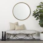 Round wall mirror with slim metal frame.
