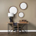 Round wall mirror with mixed wood and metal frame in industrial black and natural finish.