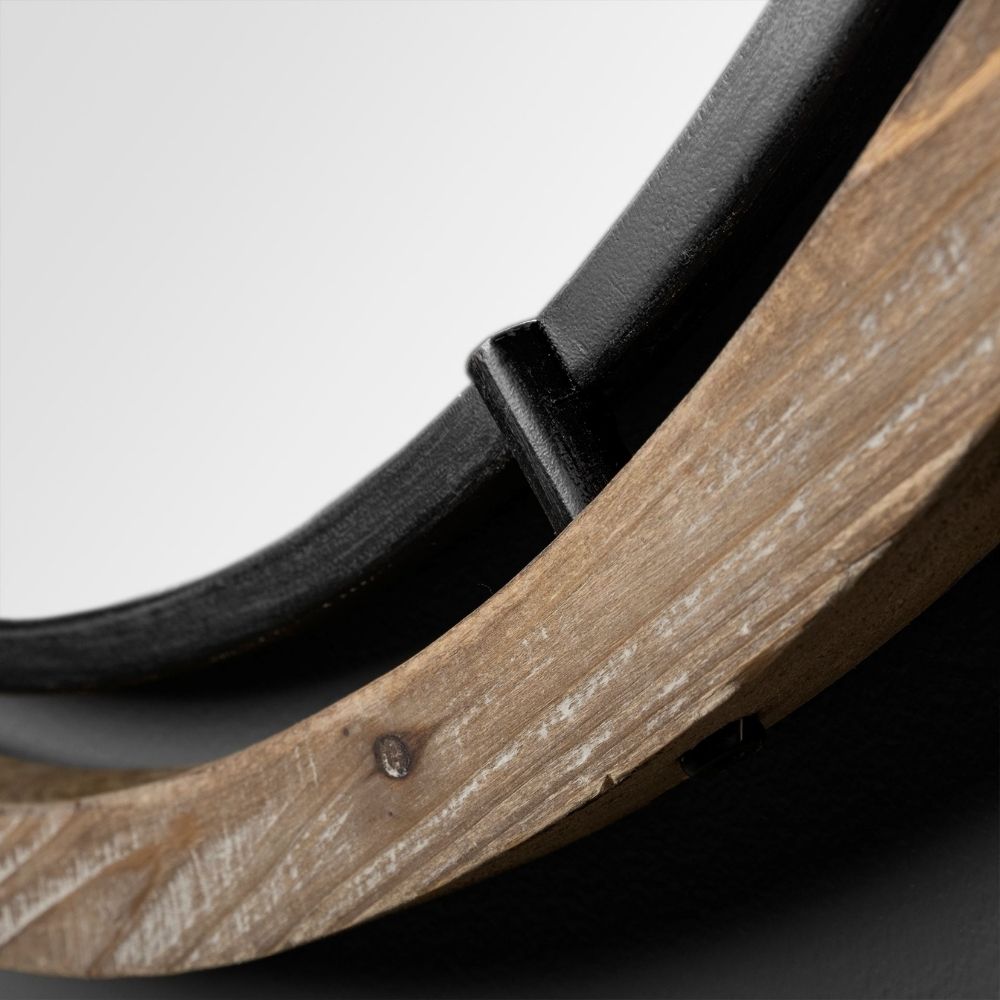 Round wall mirror with mixed wood and metal frame in industrial black and natural finish.