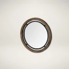 Round wall mirror with mixed wood and metal frame in industrial black and natural finish.